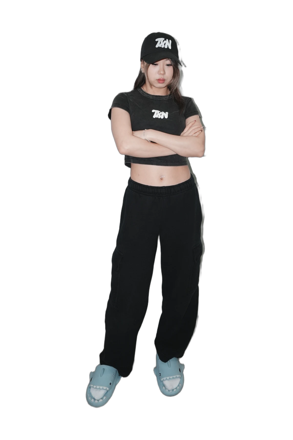 Full-body view of the model wearing the TXN hat